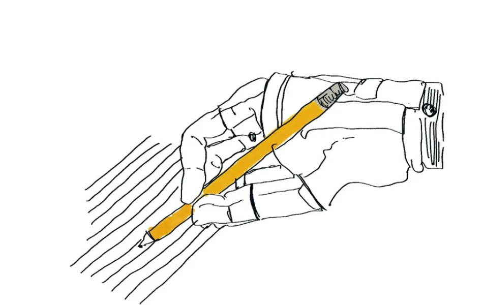 Mano ortopédica dibuja líneas con un lapicero